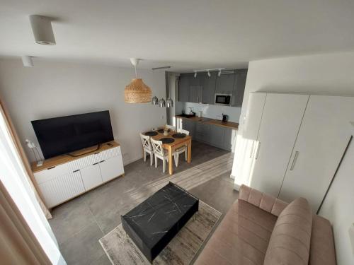 TV o dispositivi per l'intrattenimento presso Apartamenty Słoneczne Balkony