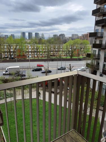 a balcony with a view of a parking lot at Charming 1-Bed Apartment in London in London