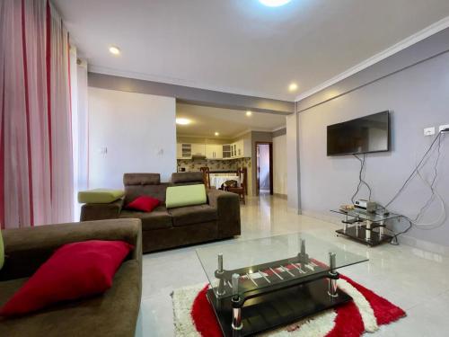 Χώρος καθιστικού στο Charming 2-Bed Apartment in Kigali