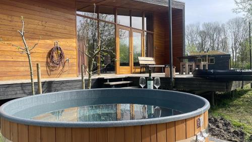a large hot tub in front of a house at The Unbound Amsterdam in Amsterdam