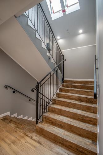 a staircase in a house with a skylight at Soul House Gdansk Old Town in Gdańsk