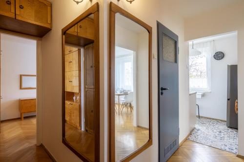 a large mirror in the hallway of a home at 20 Apart - Mieszkanie dla 4 osób in Gdynia