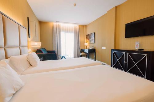 Una cama o camas en una habitación de Hotel 525