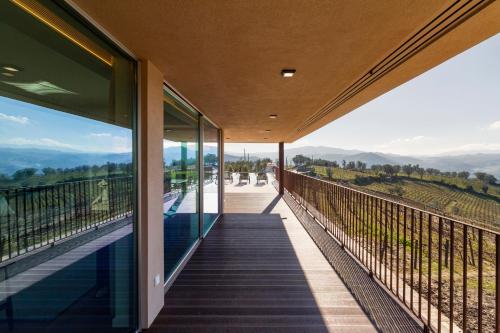 a balcony of a house with a view at Douro Valley Luxury Home with Vineyard and Infinity Pool in Santa Marta de Penaguião