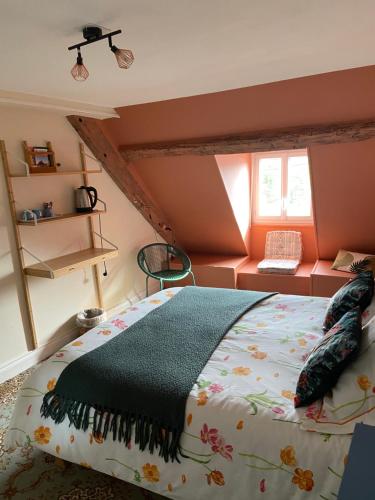 a bedroom with a large bed in a room at Atipyk'ododo in Saint-James
