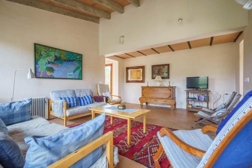a living room with a couch and a table at Font in Artá