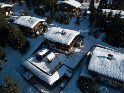 an aerial view of a house covered in snow at Apartment in Hochf gen with a terrace in Hochfugen