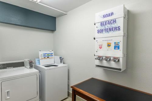 a laundry room with a washer and dryer at Quality Inn in Carrollton