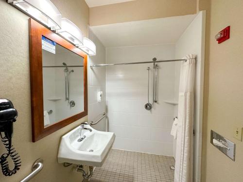 a bathroom with a sink and a shower at Country Inn & Suites by Radisson, Rock Falls, IL in Rock Falls