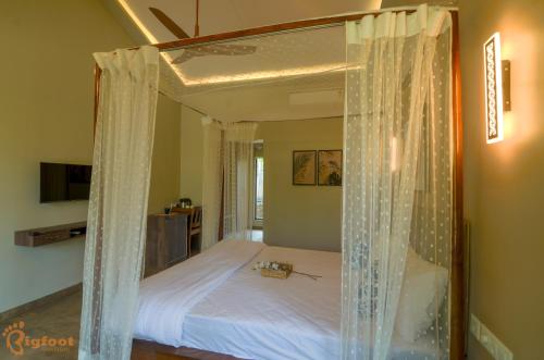 Postel nebo postele na pokoji v ubytování Jomo Resort