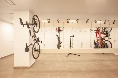 a room with several bikes on a wall at BQ Amfora Beach - Adults Only in Can Pastilla