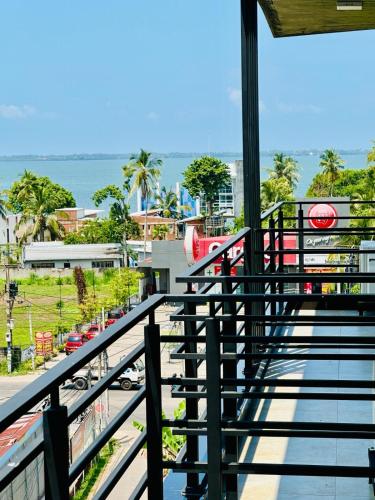 a view from the balcony of a resort with a train at Limeshine - Airport Transit Hotels & Residences in Katunayake