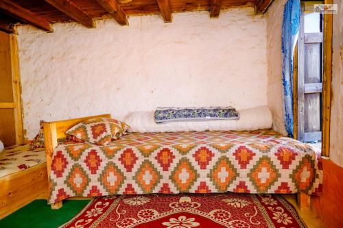 a bedroom with a bed in a room at Dhunkharka Homestay in Panaoti