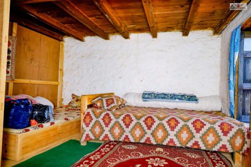 a bedroom with a bed in a room at Dhunkharka Homestay in Panaoti