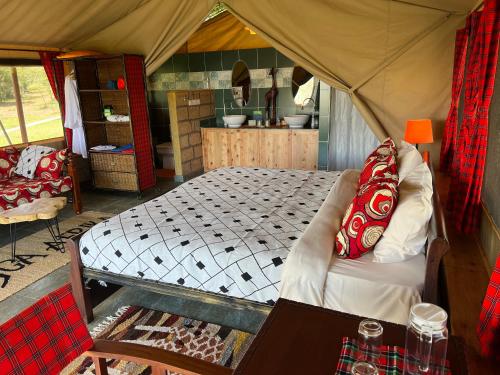 a bedroom with a bed in a tent at Nyumba ya Farasi in Naivasha