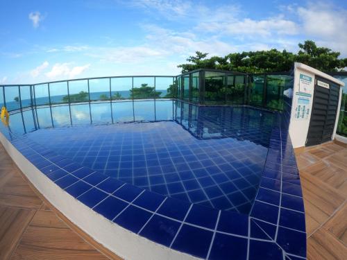 a swimming pool on the roof of a house at Maraca Beach I - Flat 102 in Porto De Galinhas