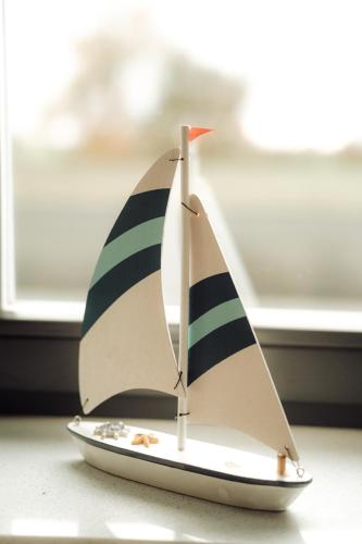 a small toy boat sitting on top of a table at Morze Tu in Stegna