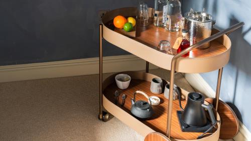 a shelf with food on it in a room at BULL Burford in Burford