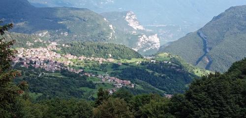 a small town in a valley in the mountains at PICCOLO NIDO in San Lorenzo in Banale
