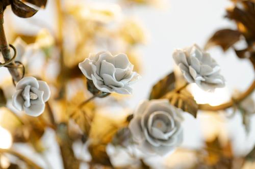 a bunch of white flowers in a vase at Villa Langberg Spa in Ventspils