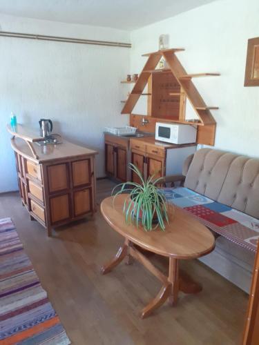 a living room with a couch and a table at Sokol in Ogulin
