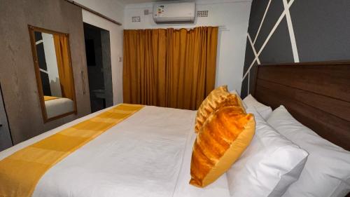 Ένα ή περισσότερα κρεβάτια σε δωμάτιο στο Gem Villa Inn