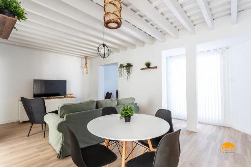 a living room with a couch and a table at Buenos Aires by Cadiz Time in Cádiz