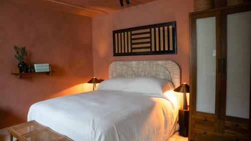 a bedroom with a white bed in a room at BULL Burford in Burford