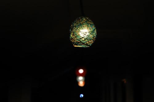 a street light and a chandelier hanging above a traffic light at Danak Farm And Resort in Sasan Gir