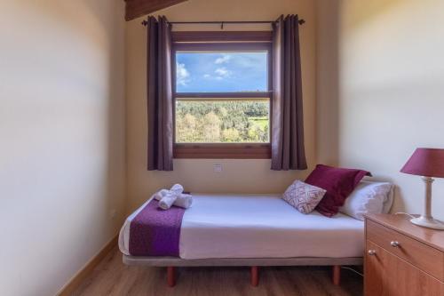 Ένα ή περισσότερα κρεβάτια σε δωμάτιο στο 43B Nature with parking by Aston Rentals