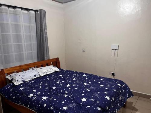 Postel nebo postele na pokoji v ubytování Klimax Homes