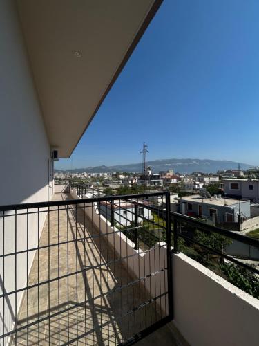 a balcony with a view of a city at Rest House in Vlorë