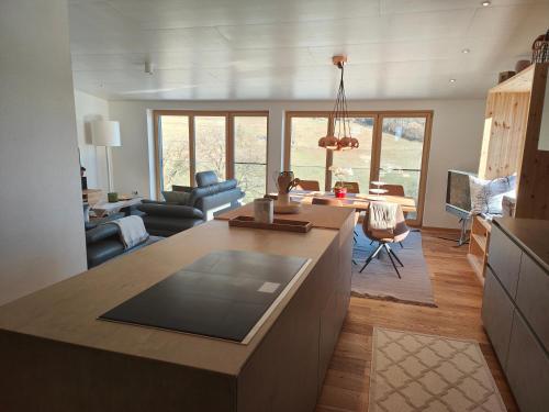 a kitchen and living room with a counter top and a living room at Thomas's Loft in Stühlingen