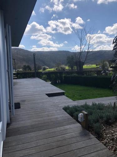 a porch of a house with a view of a yard at Chalet N°5 in Treignes