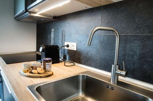 a kitchen with a sink and a counter top with a sink at ROOFTOP OASIS in Chiavari