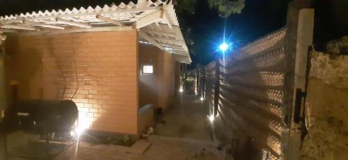 a building with a fence and a street light at Muthu Villa in Mirissa