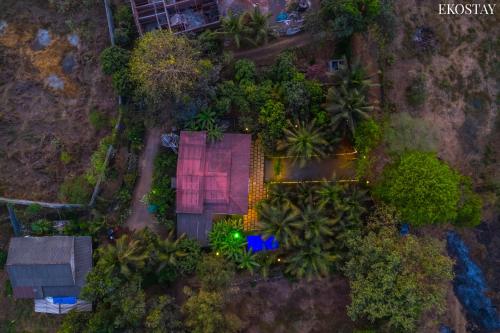 an aerial view of a resort with palm trees at EKO STAY- CASA POLO Villa in Alibaug
