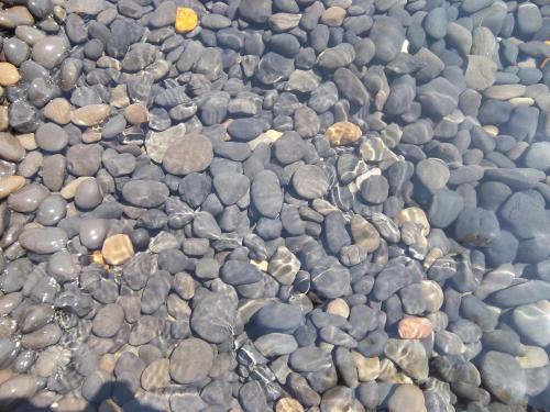 a bunch of rocks in the water at Traditional Guest house Chrisyis in Pyrgi