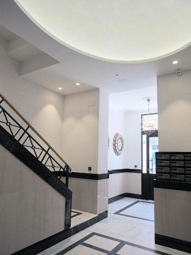 an empty lobby with a round ceiling and stairs at Catedral - Apartamentos Burgos Deluxe in Burgos