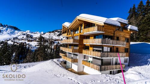 a building in the snow on a mountain at Haus Golmenegg, Riederalp in Riederalp