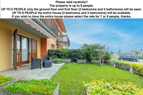 a magazine article about a house with a yard at Casa Ruby - Immobiliare Azzurra in Lazise