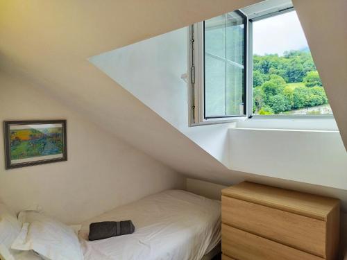 a room with a bed and a window at Chez Lolette in Luz-Saint-Sauveur
