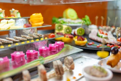 a buffet line with appetizers and other food items at Faraana Heights Aqua Park in Sharm El Sheikh