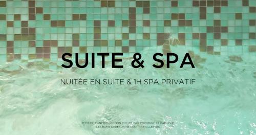 a sign that says suite and spa in front of a swimming pool at AjoieSpa in Porrentruy