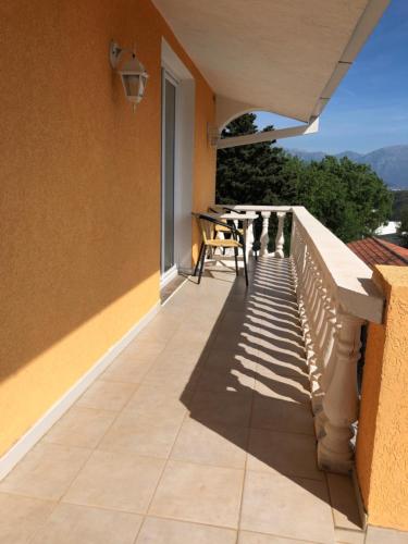 a balcony with a table and a view at Vila Bronhi in Sutomore