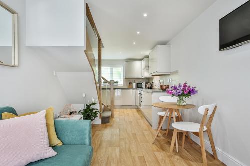 a living room with a couch and a table at 1BR Gem in Great Location With Parking in Sheffield
