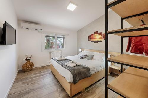 a bedroom with a bed and a bunk bed at Tenuta Dorata in Ragusa