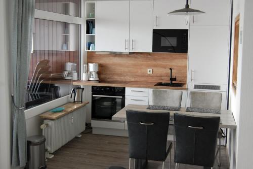 Kuchyň nebo kuchyňský kout v ubytování Grömitz- Center I App 887 inkl WLAN