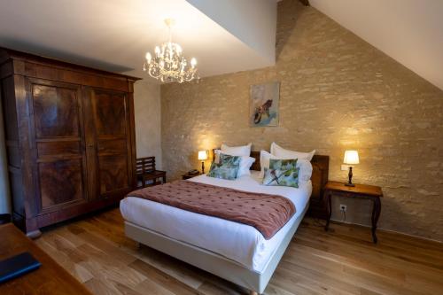 Katil atau katil-katil dalam bilik di Hôtel Le Clos