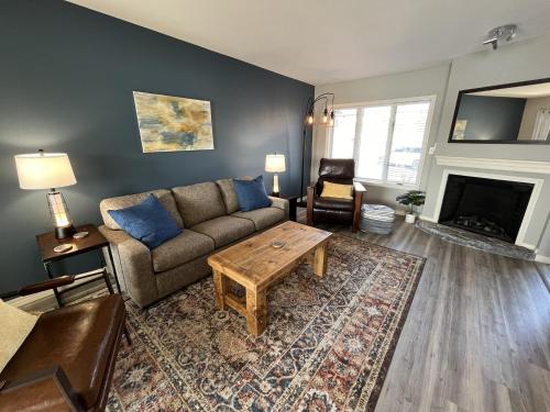 a living room with a couch and a coffee table at Serenity Oaks at The Getaways in Kimberling City